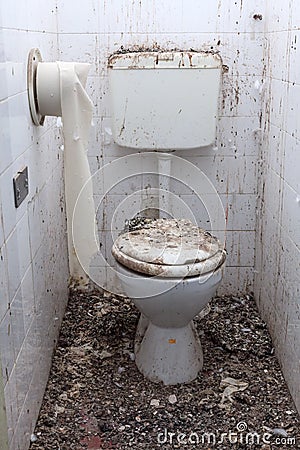 Dirty toilets in old abandoned home Stock Photo
