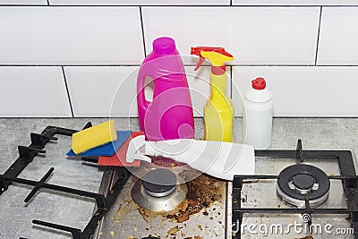 Dirty, top of the gas stove with bits of food. House cleaning Stock Photo