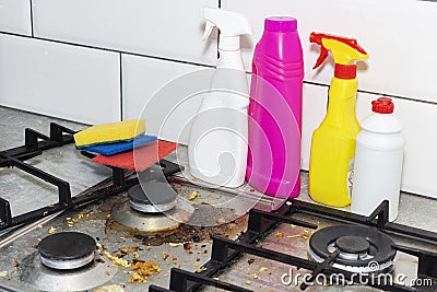 Dirty, top of the gas stove with bits of food. House cleaning Stock Photo