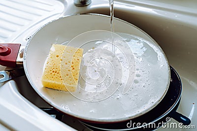 Dirty unwashed dishes in kitchen sink Stock Photo