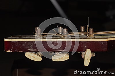 Dirty vintage old guitar fretboard. Stock Photo