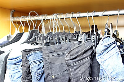 Dirty wardrobe with various women clothes Stock Photo