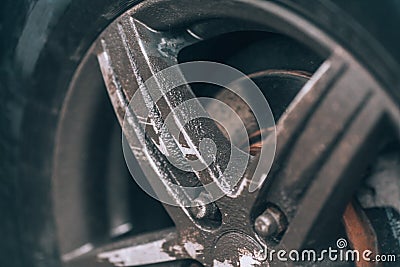 Dirty wheel. Aluminum car wheel closeup. Very dusty wheel, side view Stock Photo