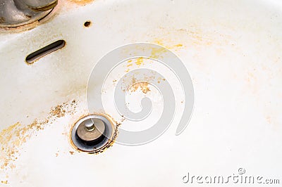Dirty white ceramic sink. Stock Photo
