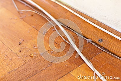 Dirty wooden floor with cables Stock Photo