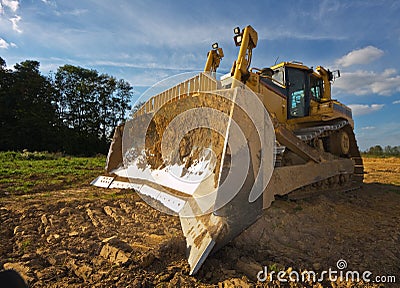 Dirty yellow bulldozer Stock Photo