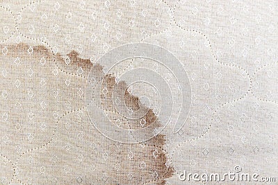 Dirty yellow spots on the mattress of the bed, bed with fundus dirty, view from above Stock Photo