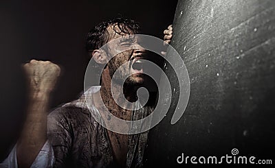 Dirtyand handsome man in despair Stock Photo