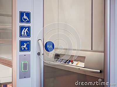 Disability signage lift facility Public accessibility Stock Photo