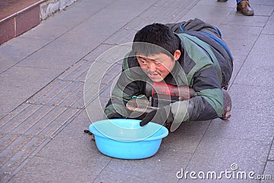 A disabled beggar in Beijing Editorial Stock Photo