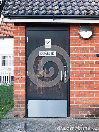 disabled black toilet door outside public park Stock Photo