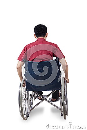 Disabled man sitting on wheelchair Stock Photo