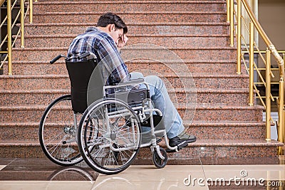 The disabled man on wheelchair having trouble with stairs Stock Photo