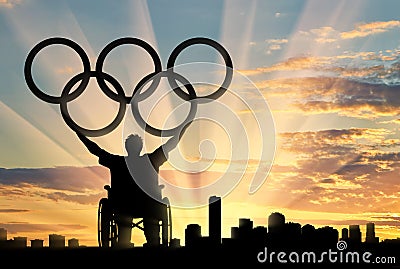 Disabled paralympic keep olympic rings sunset city Editorial Stock Photo