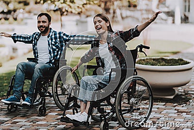 Disabled People on Wheelchairs Have Fun in Park. Stock Photo