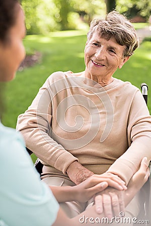 Disabled positive elderly woman Stock Photo