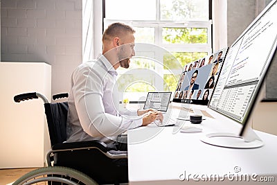 Disabled Professional Worker In Wheelchair Working Stock Photo