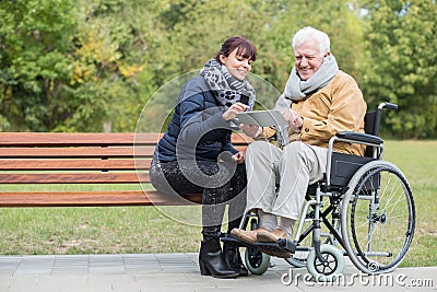 Disabled retiree in park Stock Photo