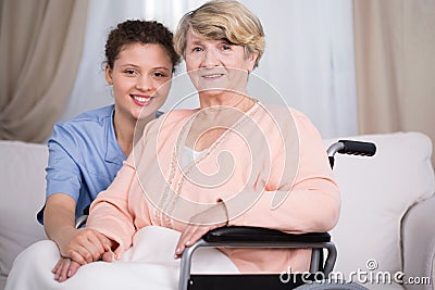 Disabled senior woman and carer Stock Photo