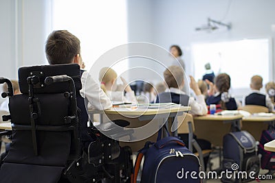 A disabled student in a wheelchair in primary school Editorial Stock Photo