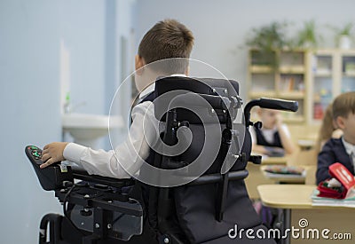 A disabled student in a wheelchair in primary school Editorial Stock Photo