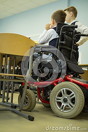 A disabled student in a wheelchair in primary school Editorial Stock Photo