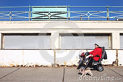 Disabled woman in electric wheel chair Editorial Stock Photo