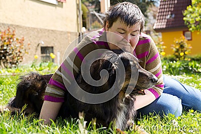 Disabled woman is lying on a lawn Stock Photo