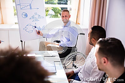 Disabled Businessman Giving Presentation Stock Photo