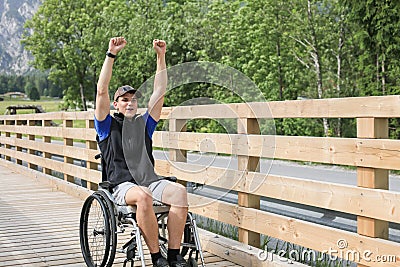 Disabled young man on a wheelchair Stock Photo