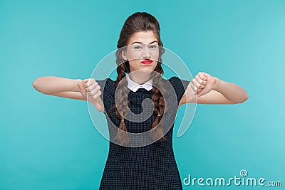 Disagree young woman demonstrate dislike sign. Stock Photo