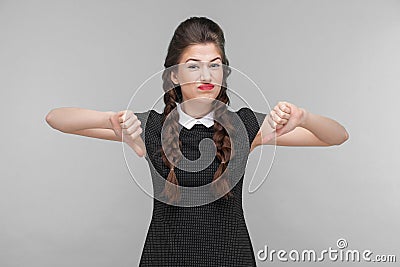 Disagree young woman demonstrate dislike sign Stock Photo