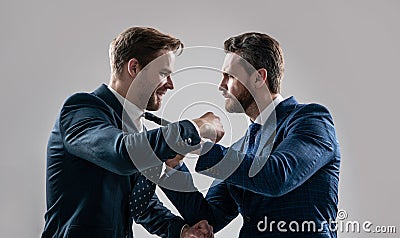 disagreed men colleague disputing and fighting aggressive and angry while conflict, standoff. Stock Photo