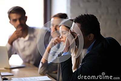 Disappointed employees stressed reading company bankruptcy news online Stock Photo