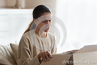 Disappointed female client frustrated by wrong online order Stock Photo