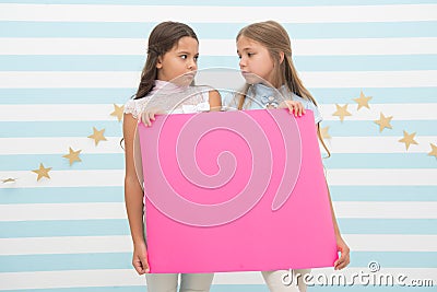 Disappointing news. Girl hold announcement banner. Girls kids holding paper banner for announcement. Children sad with Stock Photo