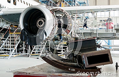 Disassembled airplane for repair and modernization in jet hangar Editorial Stock Photo