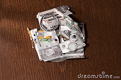 Disassembled broken compact digital camera parts Stock Photo