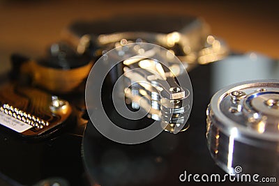 Disassembled hard drive from the computer, hdd with mirror effect. Opened hard drive from the computer hdd with mirror Stock Photo