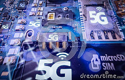 Disassembled mobile phone or smartphone without a back cover, and 5G or LTE word printed in circuit board. Macro shot. Stock Photo