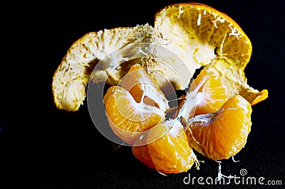 Disassembled orange mandarin Stock Photo