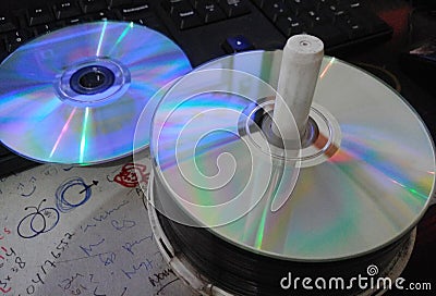 Disc glowing in the desktop and the keyboard Stock Photo