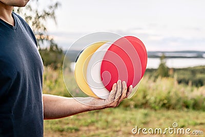 Disc golf. Discgolf or ultimate equipment. Park course and nature landscape. Throwing to target, goal or basket. Sport tournament. Stock Photo