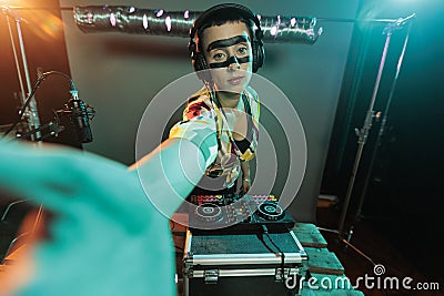 Disc jockey using turntables to mix music Stock Photo