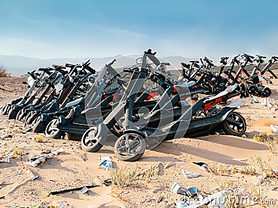 Discarded E-scooters in landfill Stock Photo