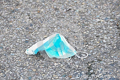 Face mask littering the road Stock Photo