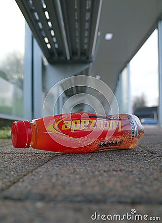 Discarded Lucozade Plastic Bottle in a Bus Shelter Editorial Stock Photo