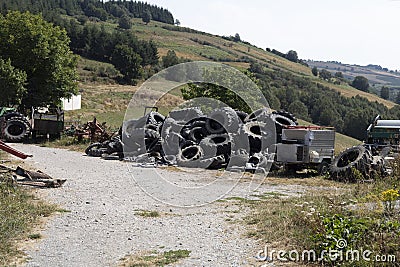 Discarded tires in the countryside. Environmental pollution. Editorial Stock Photo