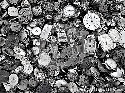 Discarded watch workings with bright faces Stock Photo