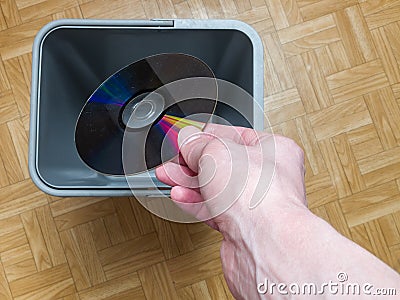 Discarding a computer laser CD, the concept of obsolescence of computer components, the evolution of computer Stock Photo